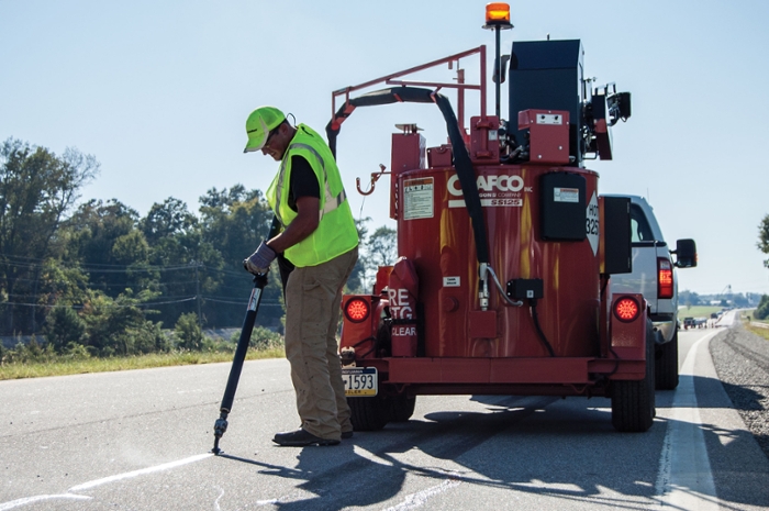 Sealant is precisely applied to cracks in a U.S. Route 280 pavement preservation test section.