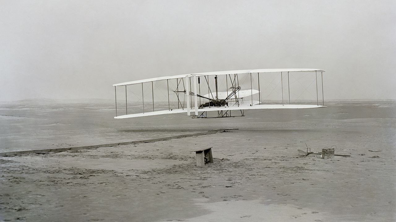 Historic black-and-white photograph of an early airplane
