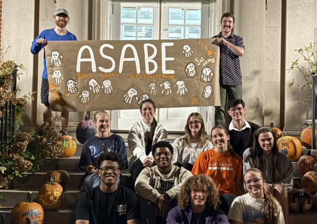 ASABE students sitting on the front steps of Corley Hall