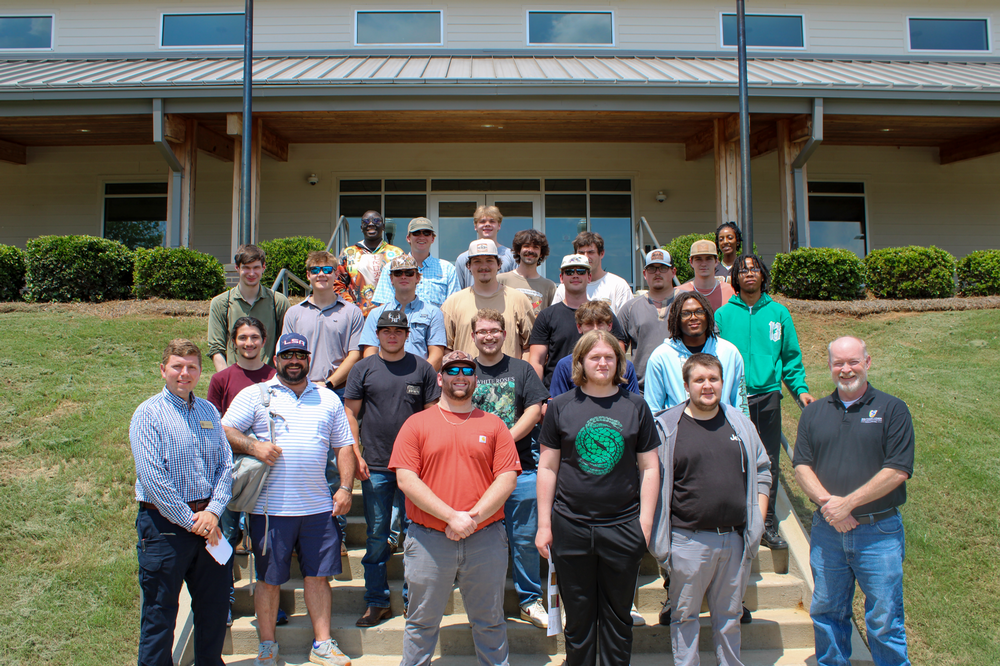 Students posed in front of the Miller Poultry Center
