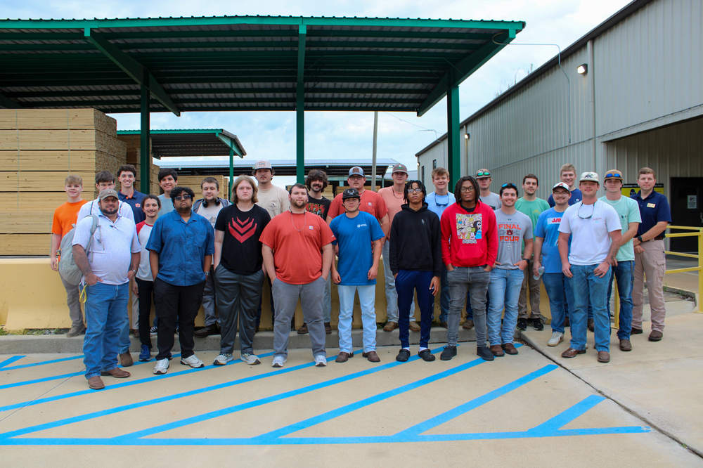 group picture of students at the West Frazier Forestry Mill for a tour