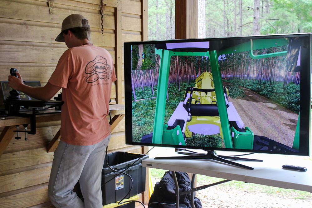 television displaying what a student is doing on a John Deere Forestry simulator