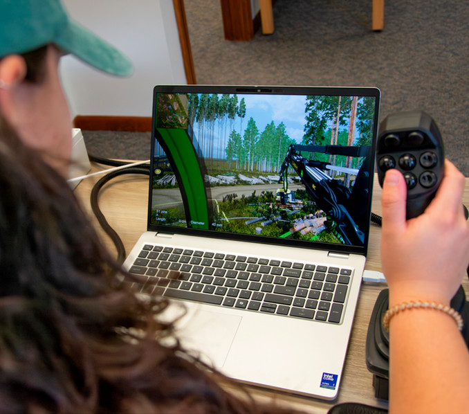 Laptop that is running a forestry simulator while a student is using it