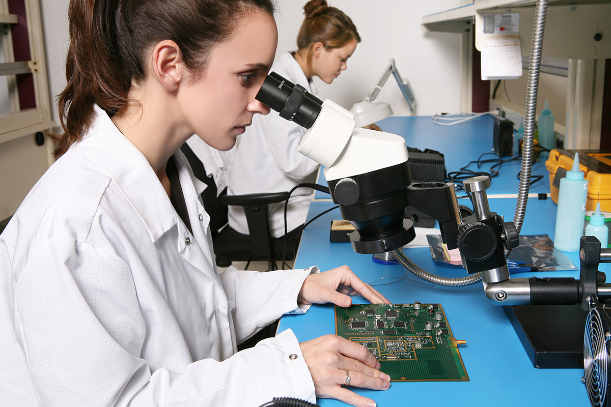 student analyzing computing board