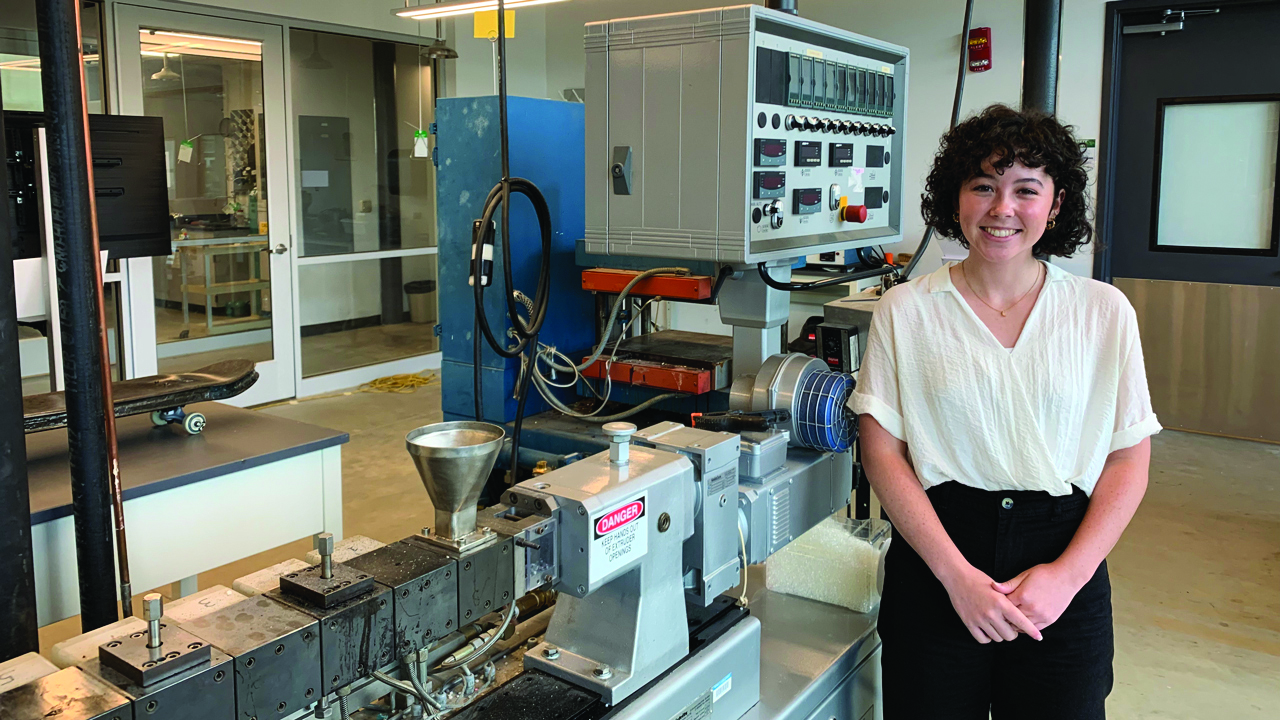woman stands in lab