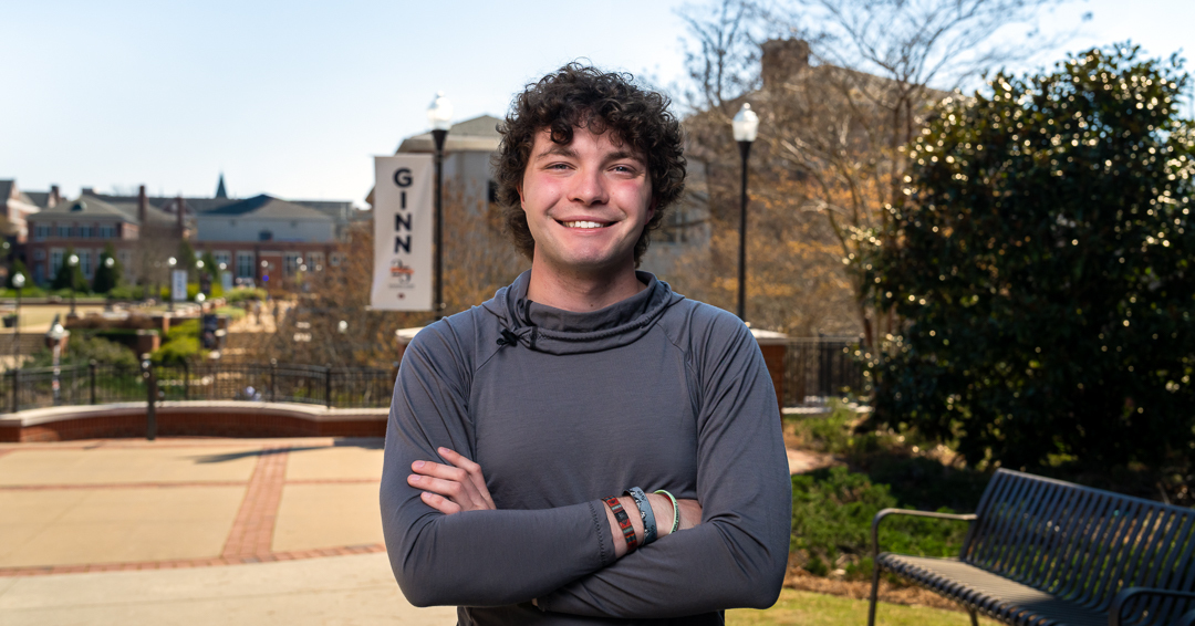 A prospective student poses with Aubie during Future Engineer Fest 2026.