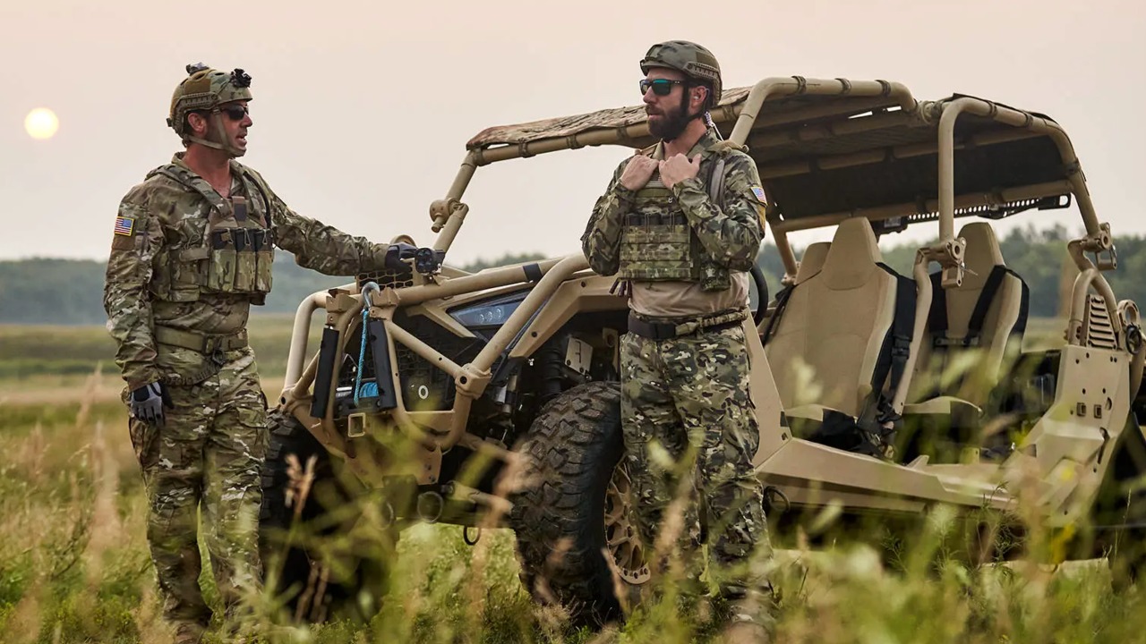 Soldiers stand next to a Polaris MRZR Alpha 4 vehicle. [Image: Polaris]