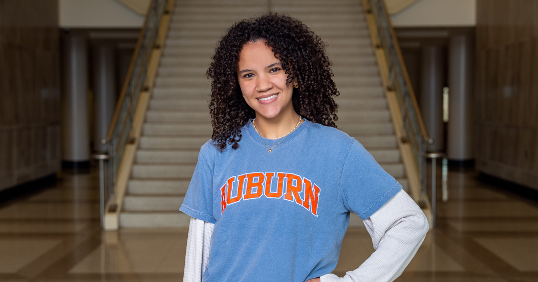 ICAMS instructor demonstrates a robotic arm to a participant during a hands-on advanced manufacturing training session.