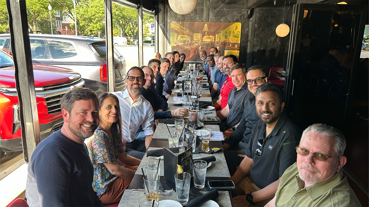 A large group of people sitting at a table.