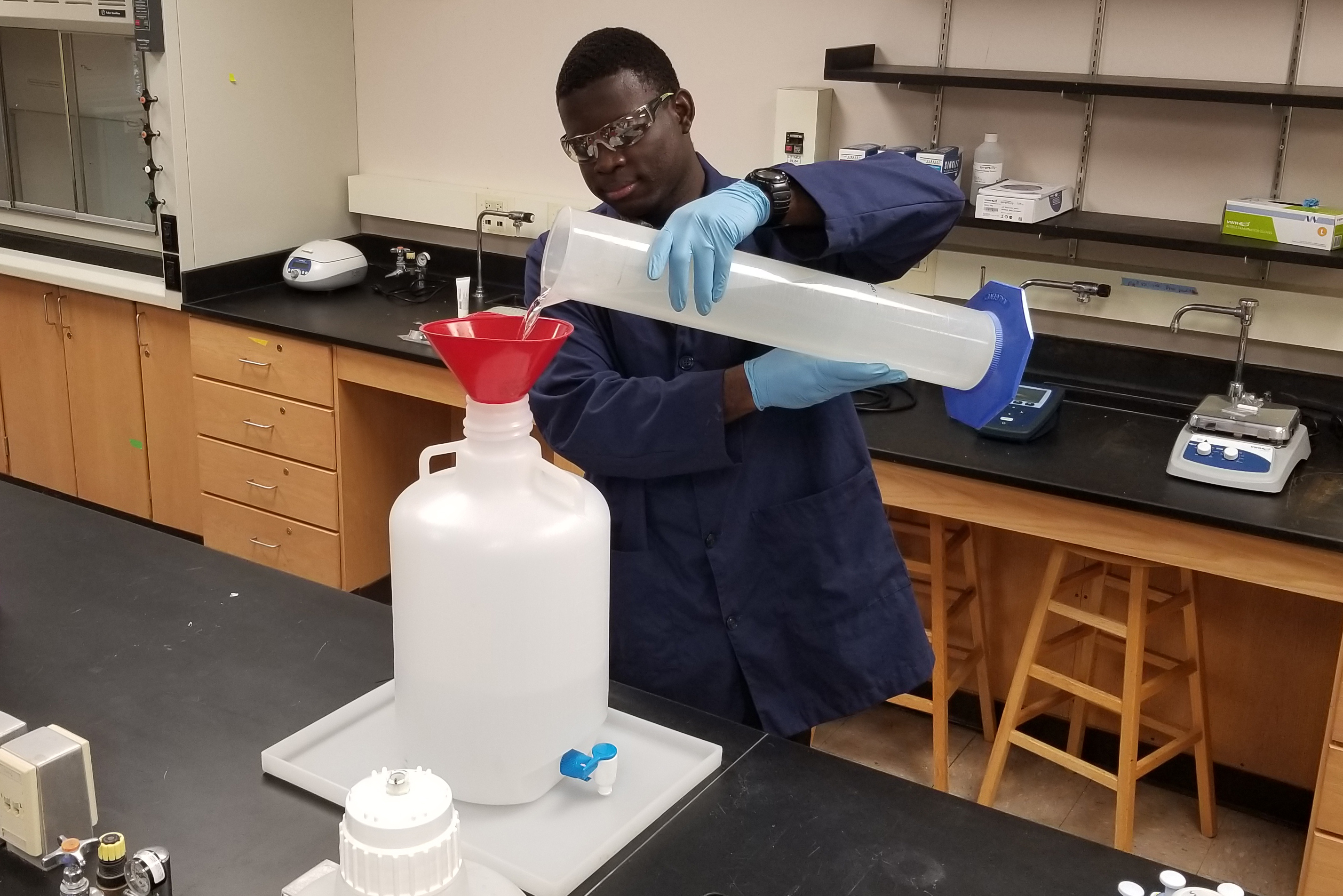 Emmanuel Winful mixing hand sanitizer