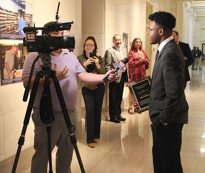 A generic square placeholder image with rounded corners in a figure.