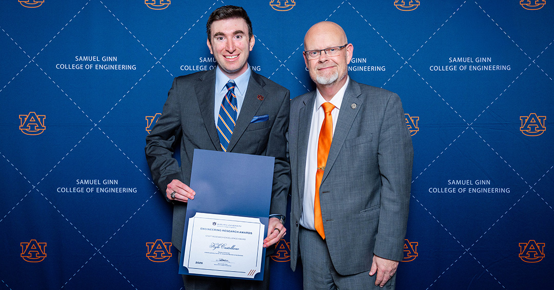 Staff research excellence award-winner Kyle Castellano, left, research engineer at the Interdisciplinary Center for Advanced Manufacturing Systems, with Mario Eden, dean of engineering.