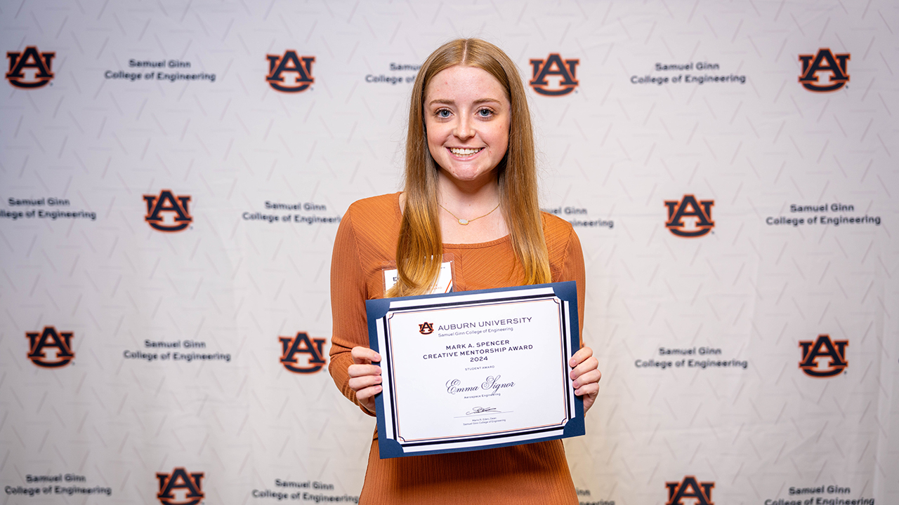 Emma Signor, an aerospace engineering graduate, holds the Mark Spencer Creative Mentorship Award earned at the Samuel Ginn College of Engineering annual spring awards ceremony in April 2024. Signor plans to return to Auburn in the fall of 2024 to obtain a master's degree in aerospace engineering.