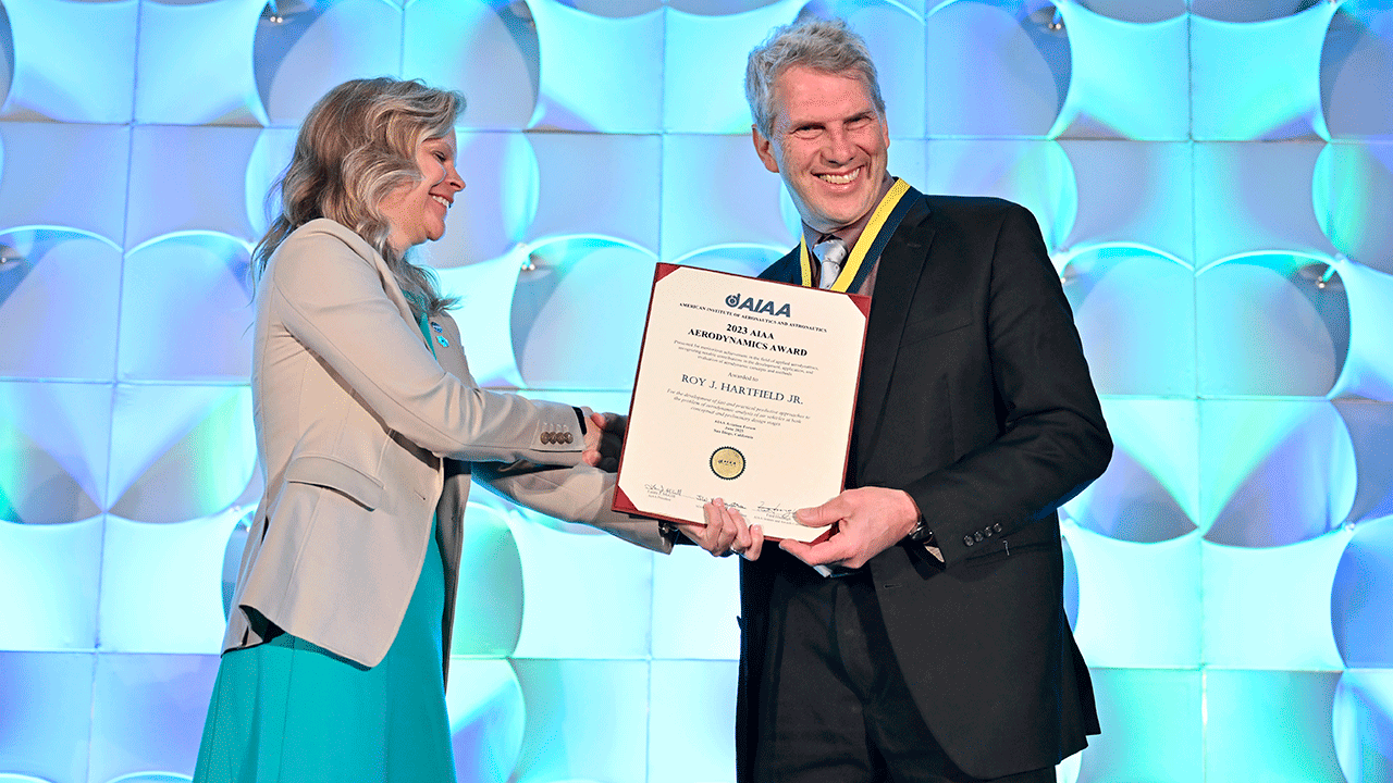 Roy Hartfield, right, has devoted a 30-plus year career to the study of aerodynamics, propulsion, statistical analysis of air vehicles, and aircraft research.