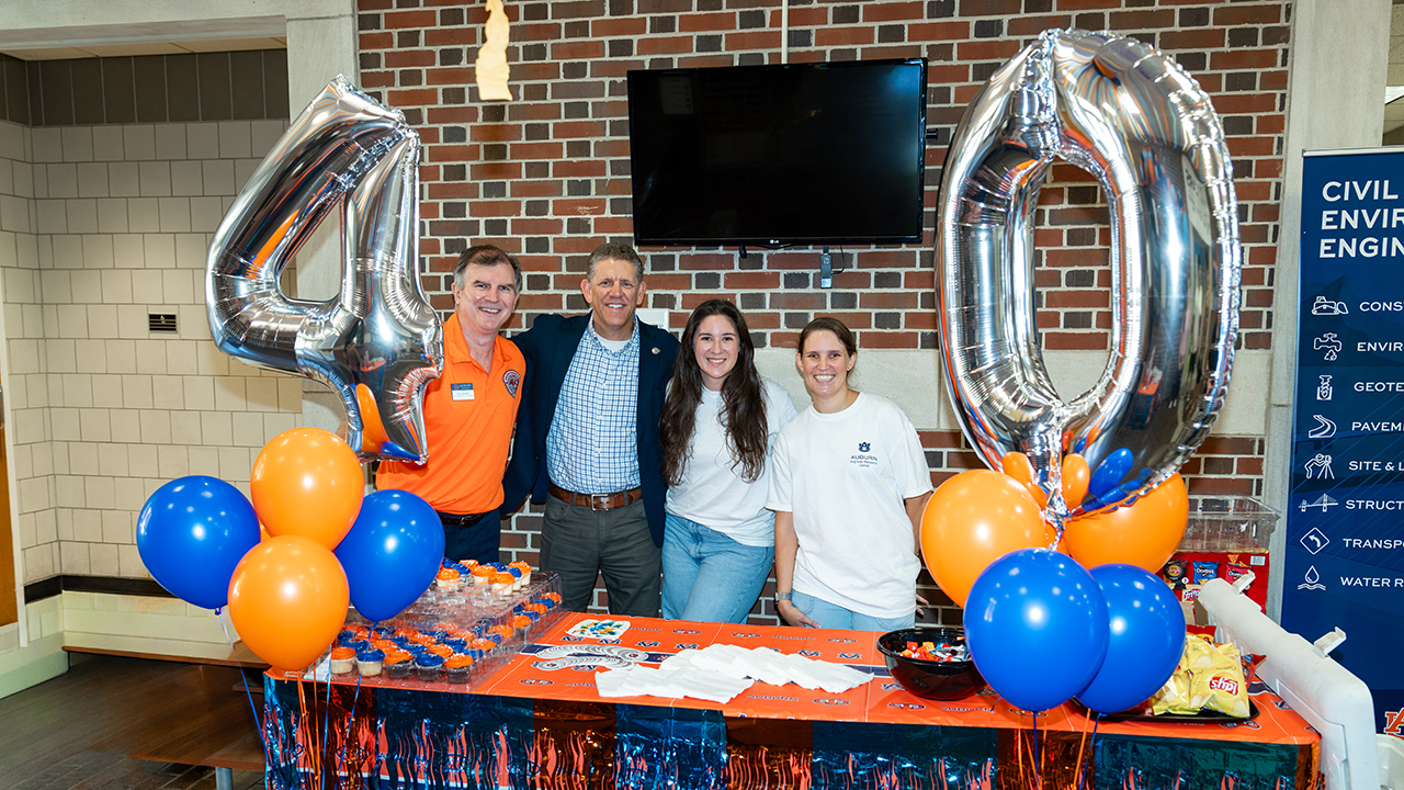From left, Anton Schindler, director of the Highway Research Center, David Timm, chair of the Department of Civil and Environmental Engineering, Corie McConnell, academic services administrator and Katie Falls, academic program administrator celebrate the 40-year anniversary of the Highway Research Center in the Harbert Center in late October. 
