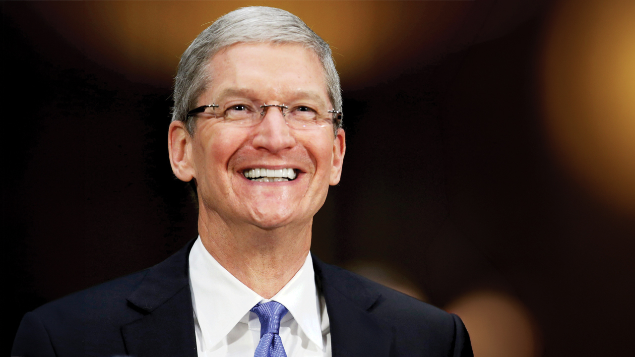 Tim Cook smiles during a public appearance.