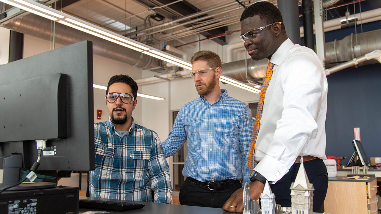 Emmanuel Winful, right, is the college's health and safety manager.