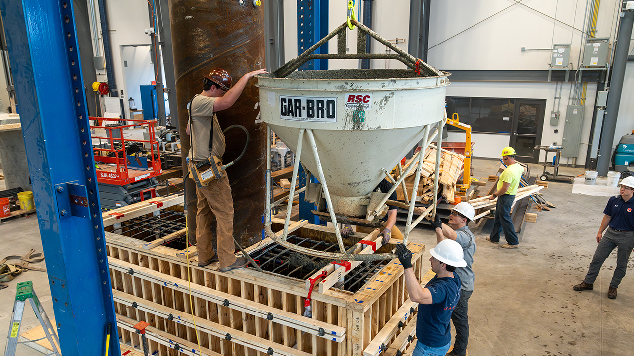 Students in ASEL prepare to pour concrete as part of an experiment.