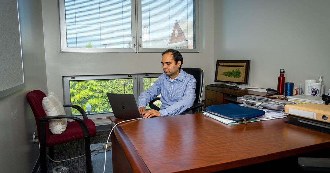 Nek Sharan, aerospace engineering  assistant professor, works in his office. His NSF fellowship will support the development of computational tools for simulating complex, high-speed flows in aerospace systems.