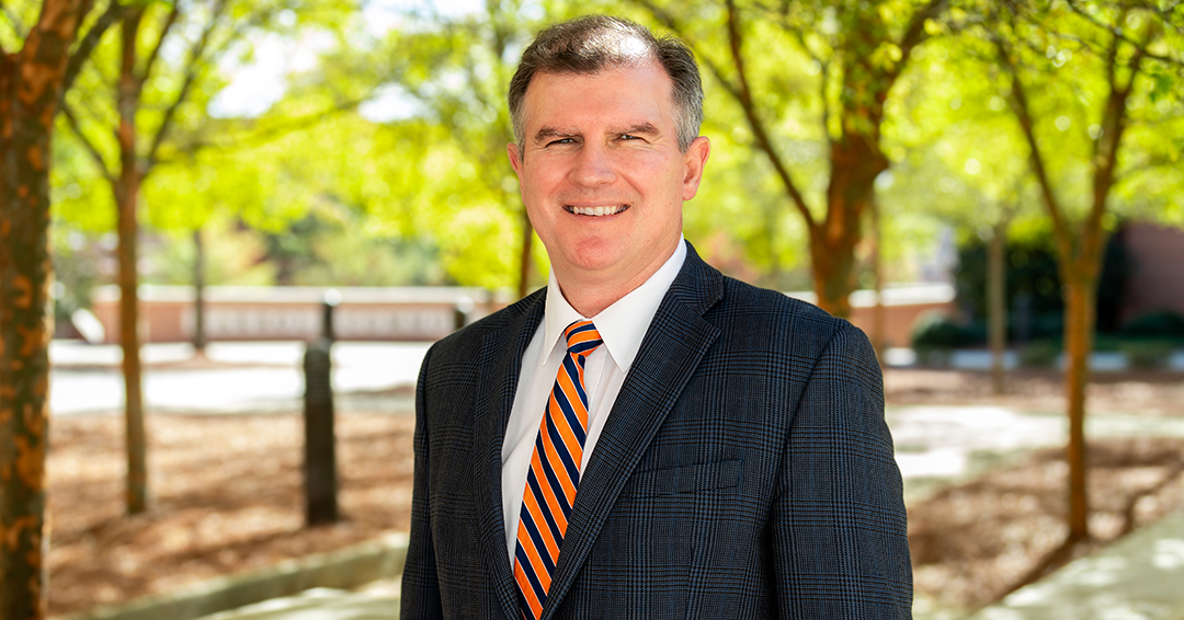 Anton Schindler stands outside on Auburn University’s campus after being elected vice president of the American Concrete Institute.