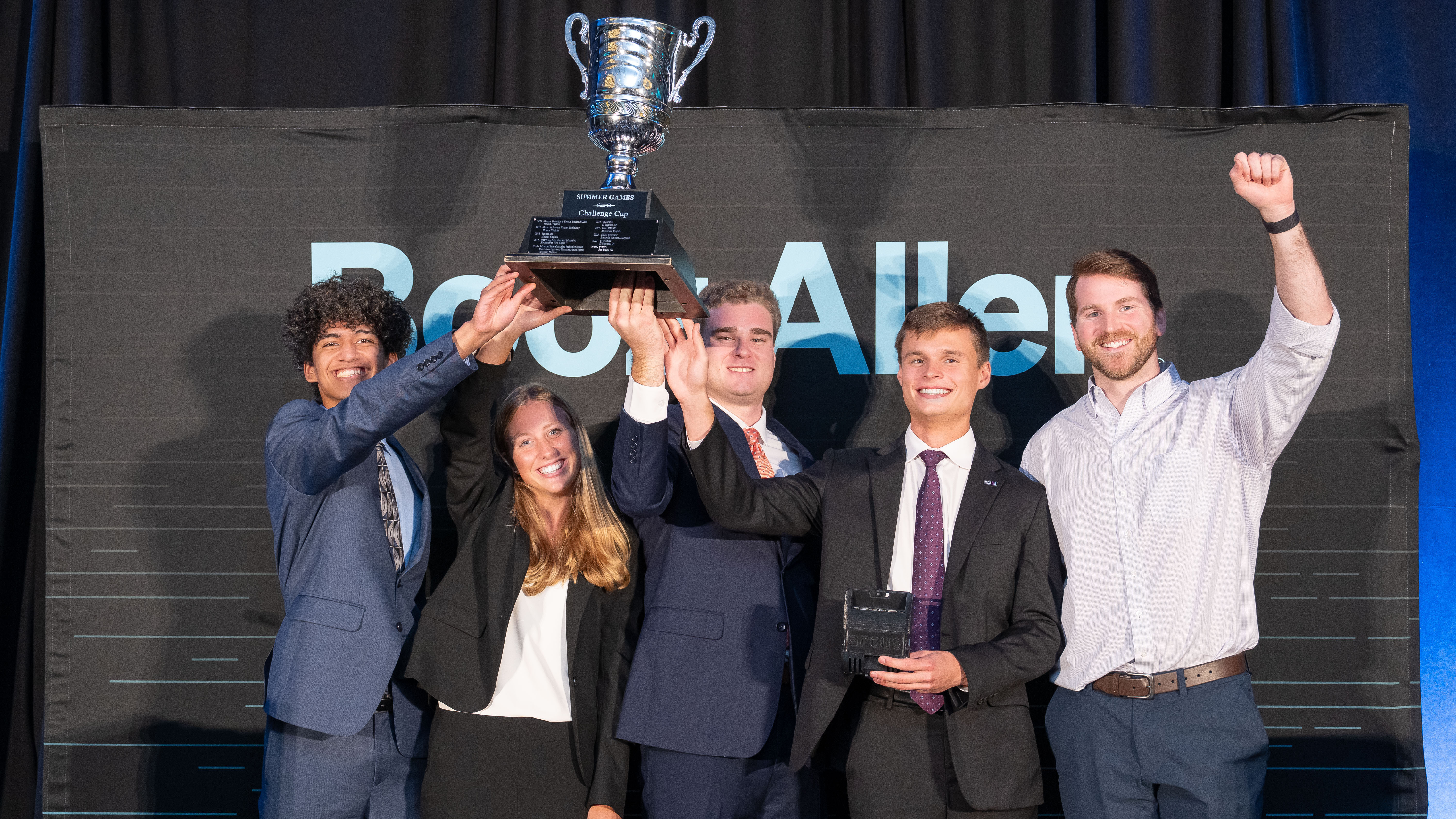From left, Joshua Soberano, Anna Kate Boles, Gavin Lewis, Will Reynolds and Michael Stroebel celebrate winning the Booz Allen Summer Games competition in Washington, D.C.