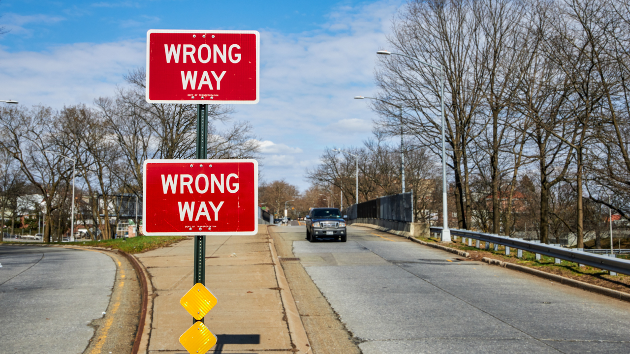Two red wrong way signs on off-ramp.