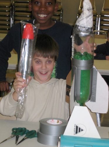 Kids performing bottle rocket simulation 