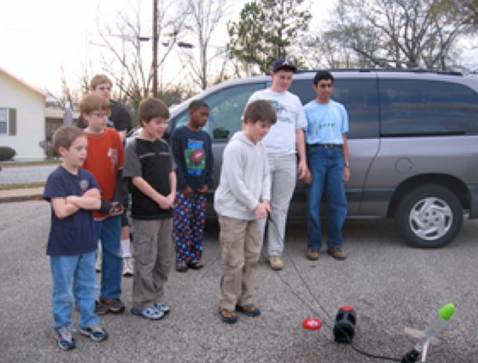 kids performing rocket simulation 