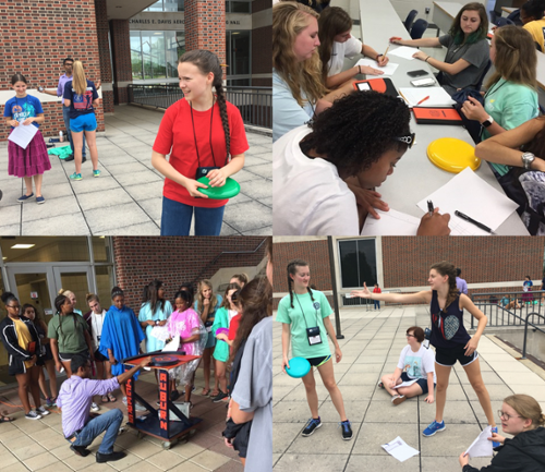 Young girls outside playing frisbee 
