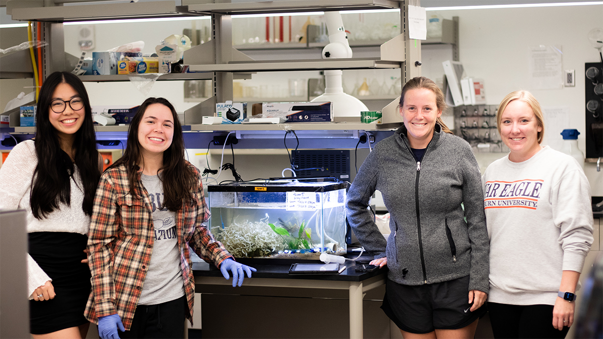 Four students in the crayfish lab