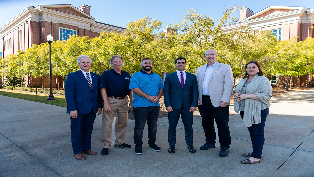 Auburn University's role in the NASA Parts Engineering School is a collaboration between the graduate school and several departments throughout the College of Engineering. Pictured left to right: George Flowers, dean of the graduate school; John Evans, the Charles D. Miller chair professor of industrial and systems engineering and director of the Thomas Walter Center; former student Seth Gordon; Sa'd Hamasha, the Hal N. and Peggy S. Pennington associate professor of industrial and systems engineering; Jeffrey Suhling, department chair of mechanical engineering; and Maria Auad, associate dean for graduate studies and faculty development.