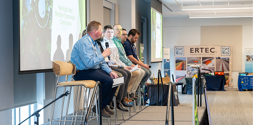 Panelists speaking during a municipal wet weather conference