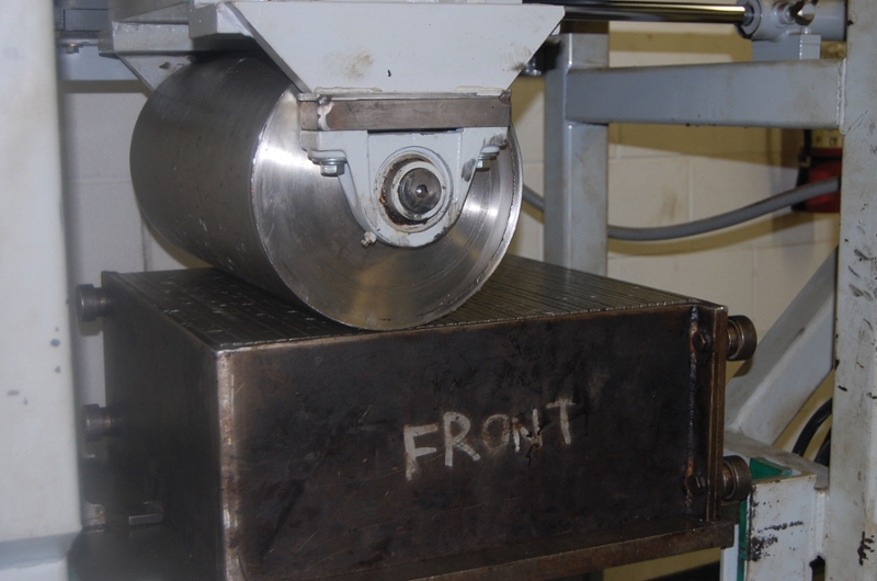 Figure 1: Preparing 20x20 Slabs with a Linear Kneading Compactor