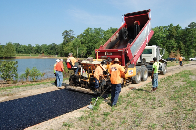Allen Asphalt Services, Inc out of Smith Station, Ala. paves the porous asphalt path.