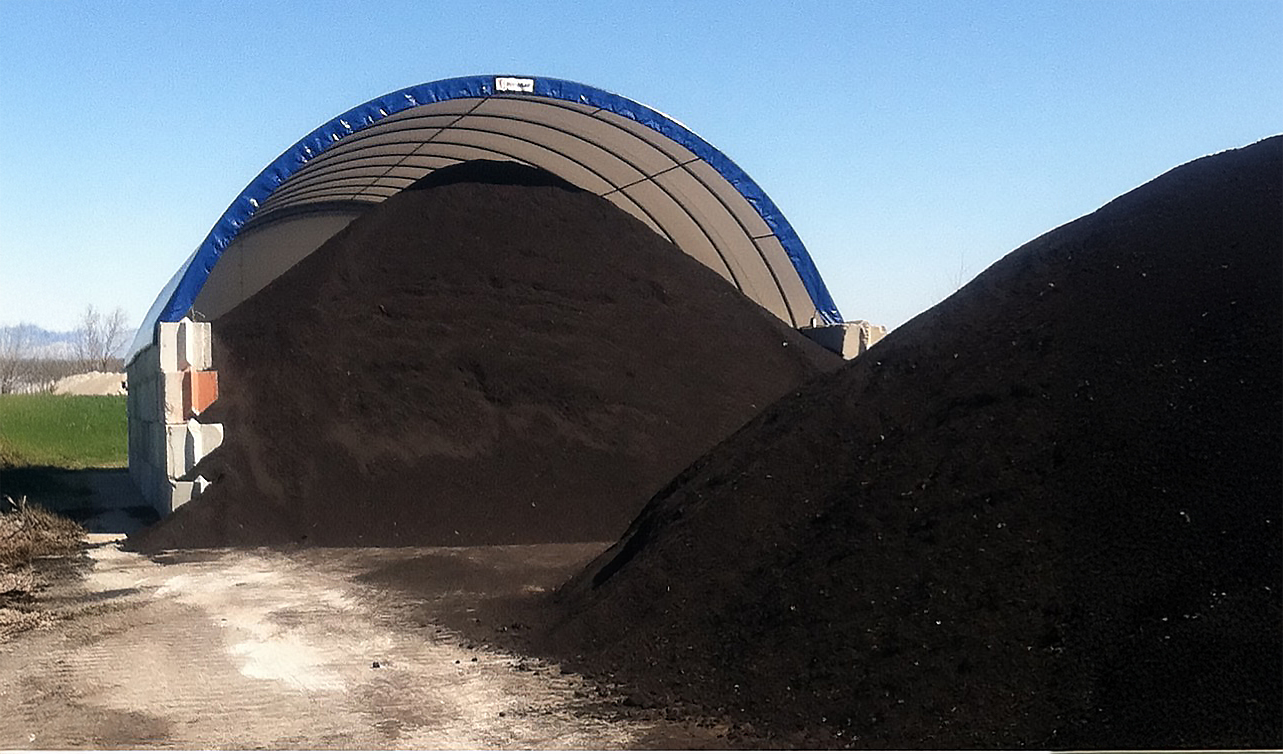 Processed stockpiles of Recycled Asphalt Shingles (RAS).